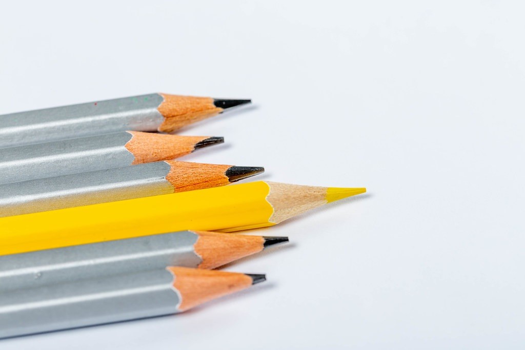 standing out pencil (yellow pencil and the rest are grey)